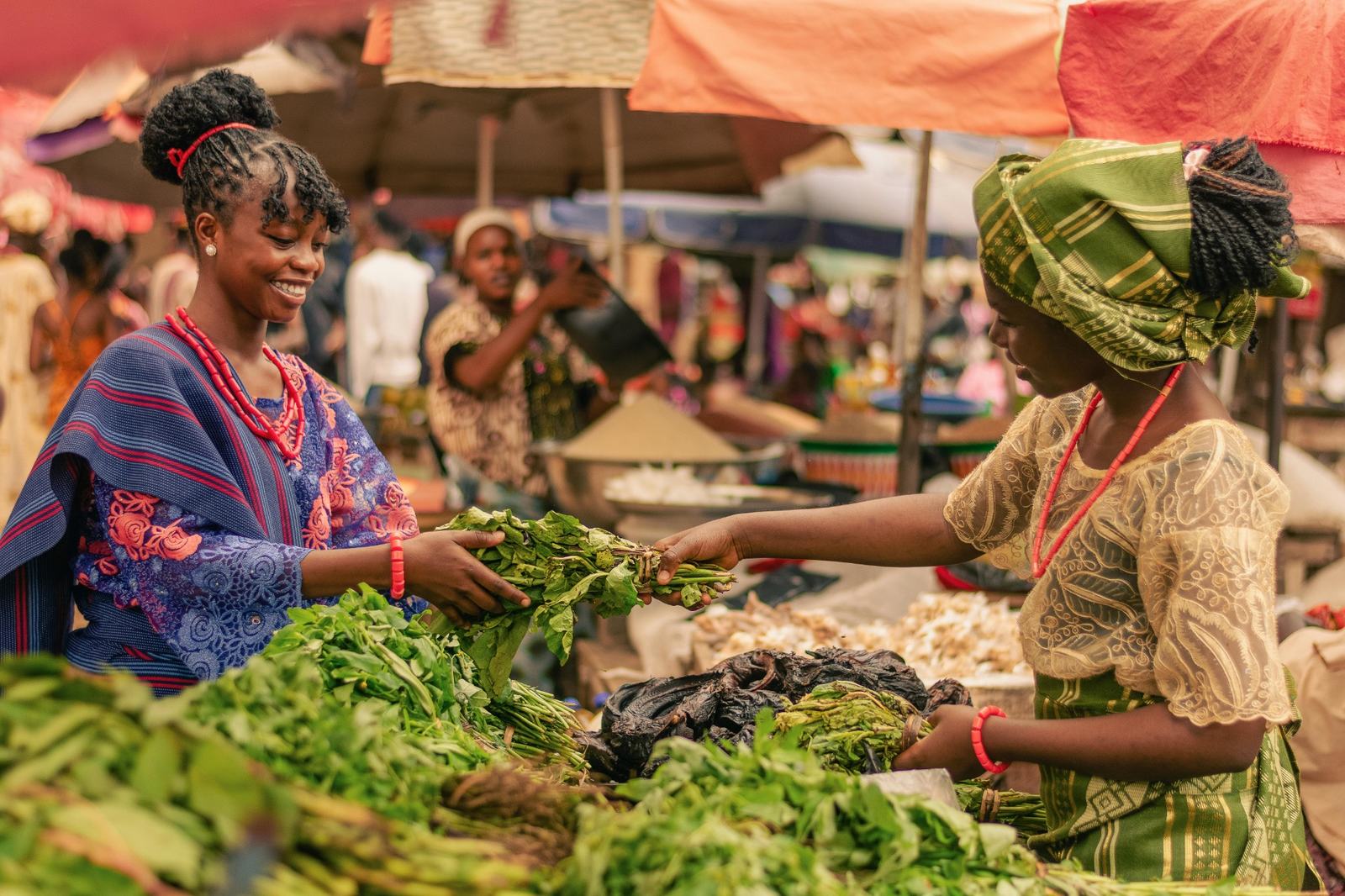 African market sellers exchanging produce